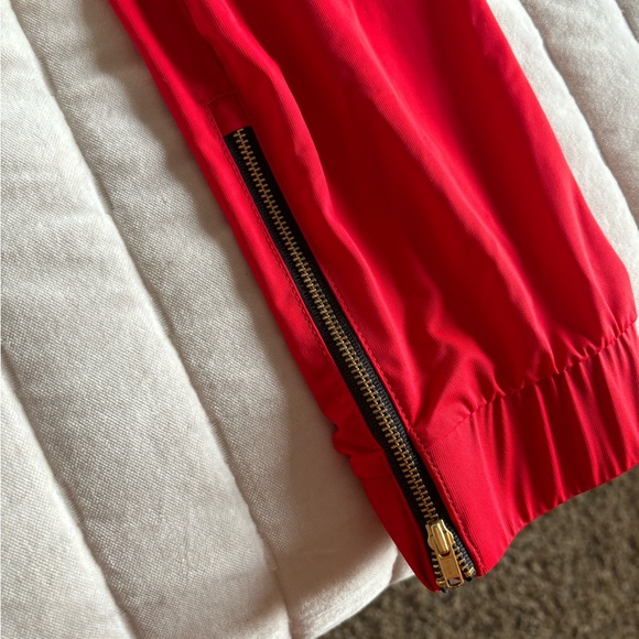 Adorable red zyia jogger pants with zipper detail. Size small. - Picture 2 of 3